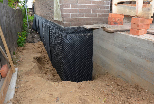 Happy homeowners after waterproofing job in Woodburn